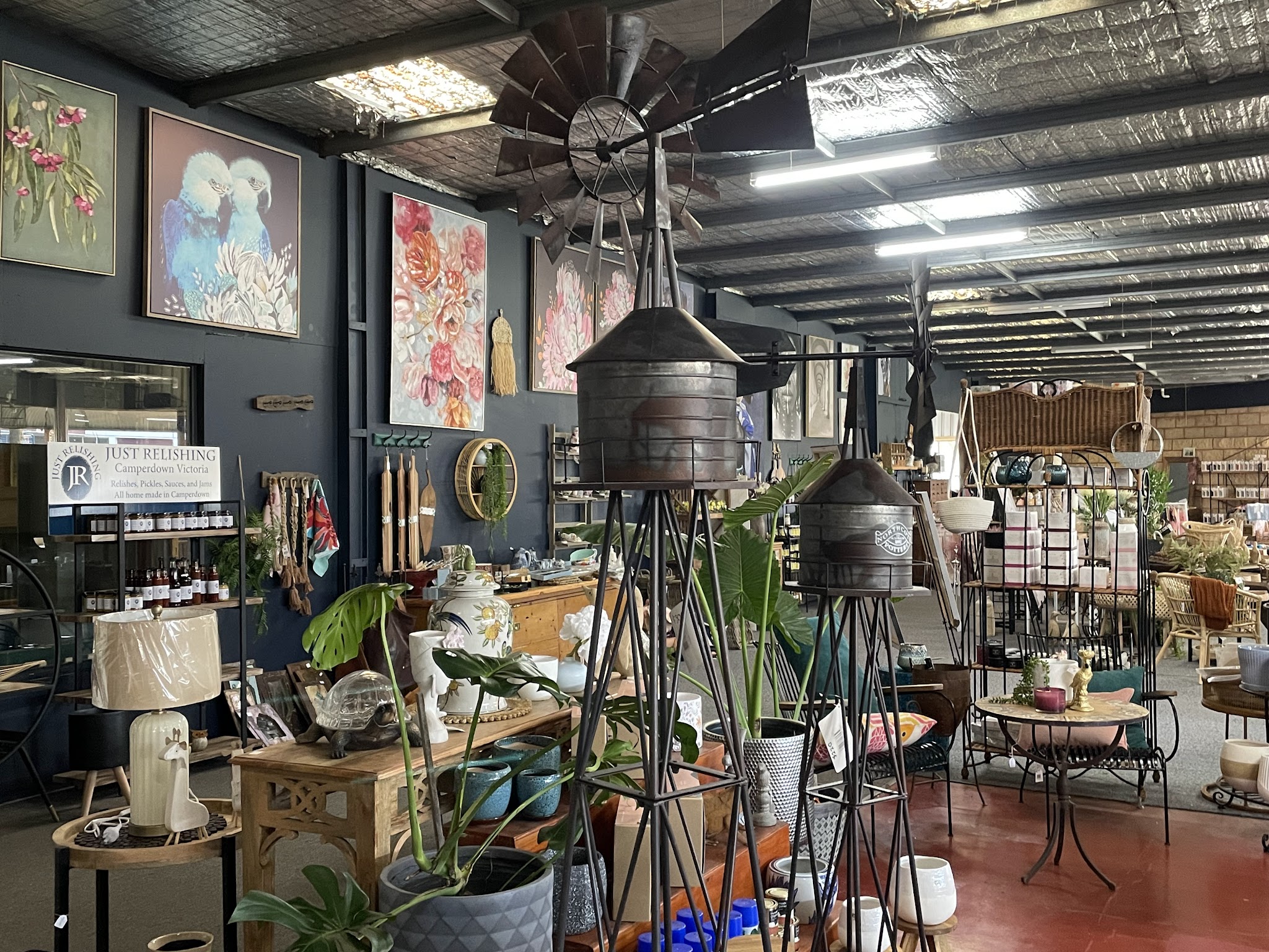 Metal windmills, botanical canvases on navy walls and the Just Relishing local produce shelf