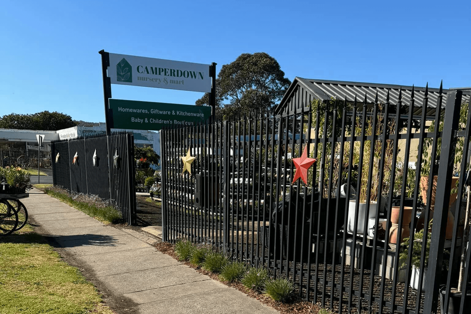 The Camperdown Nursery and Mart street sign on Manifold Street, reading homewares, giftware and kitchenware and baby and children's boutique